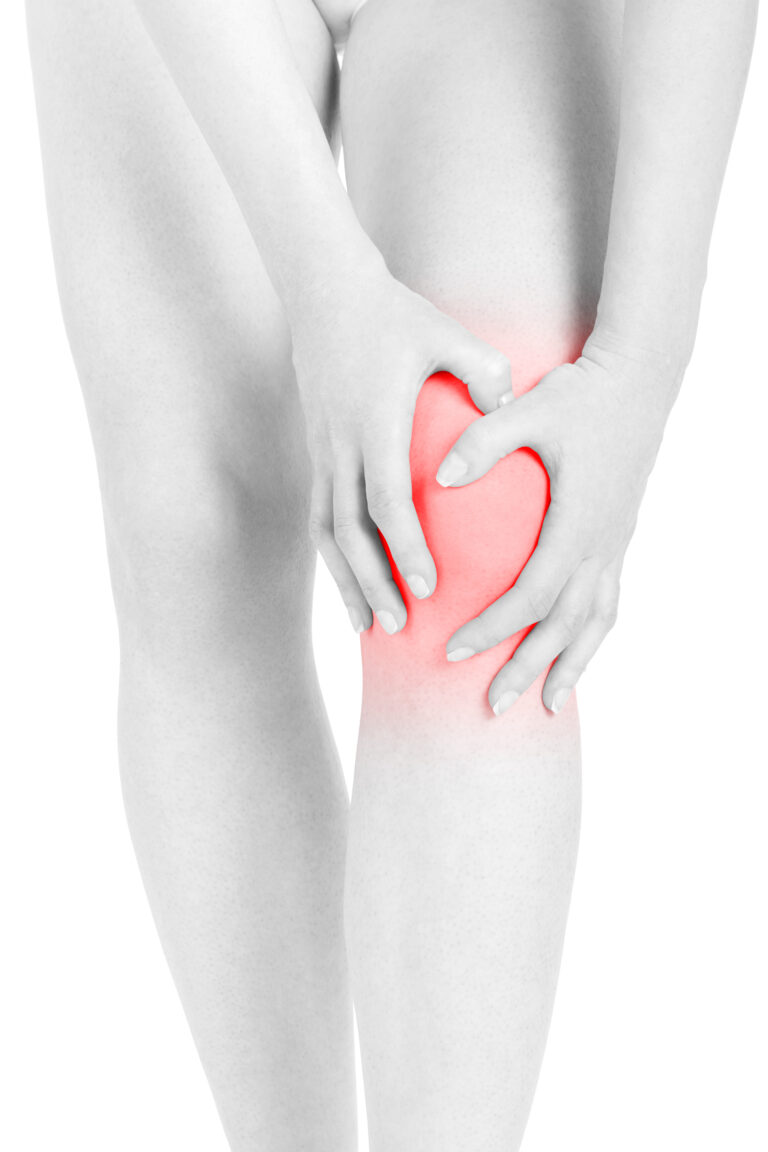 Woman fatigued legs with hands touching knee, red area isolated